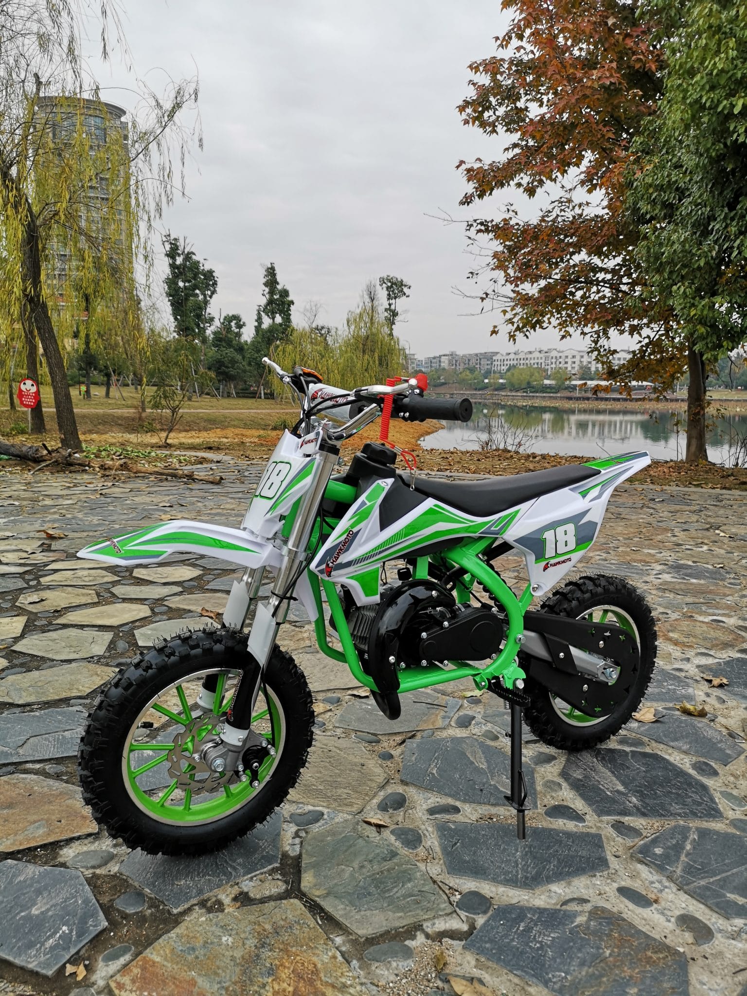 Hawkmoto Strike V2 50cc Kids Mini Dirt Bike Green Outside Play
